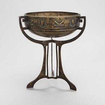 A early 20th-century Jugend Style brass bowl with glass liner.