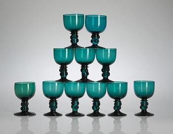 96. A set of 11 green white wine glasses, mid-19th century.