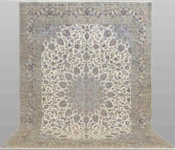 A Keshan carpet, signed, approx. 408 x 295 cm.