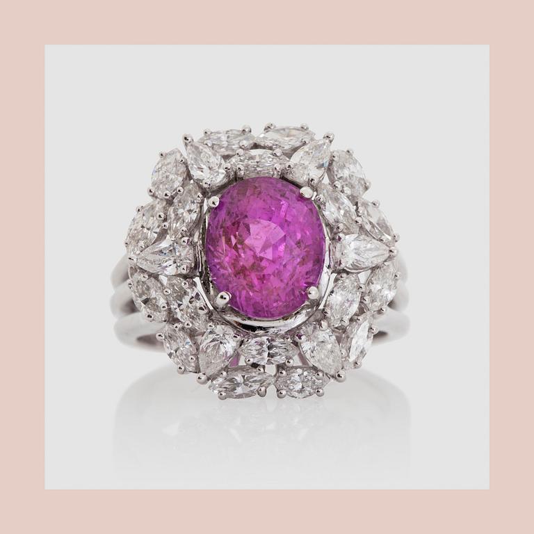 RING, with a pink sapphire, circa 4 cts, marquise and pearshaped diamonds circa 1.54 ct .