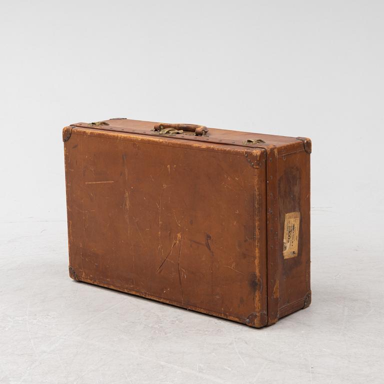 Louis Vuitton, a leather suitcase, first half of the 20th Century.