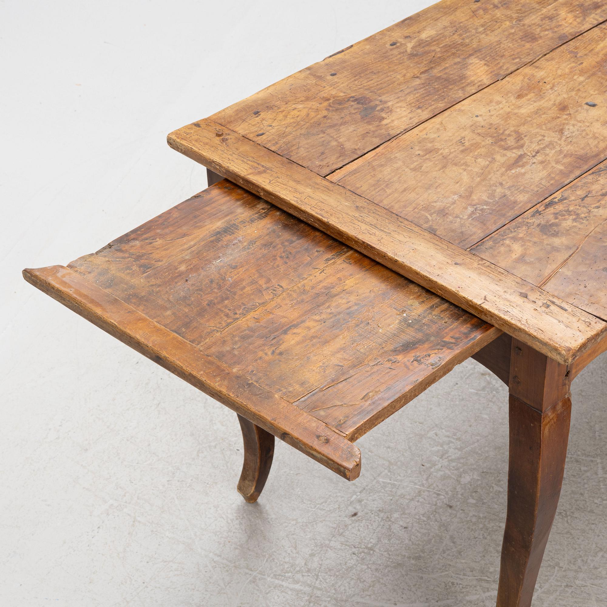 A Rococo Dining Table, 18th Century.
