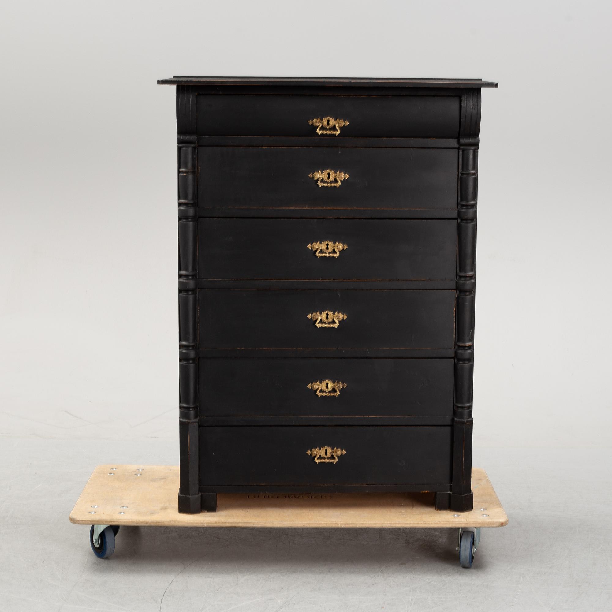 A painted chest of drawers, circa 1900.