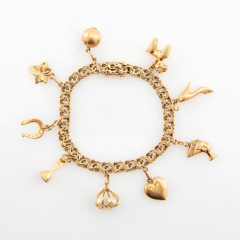 Bracelet Bismarck link 18K gold with charms.