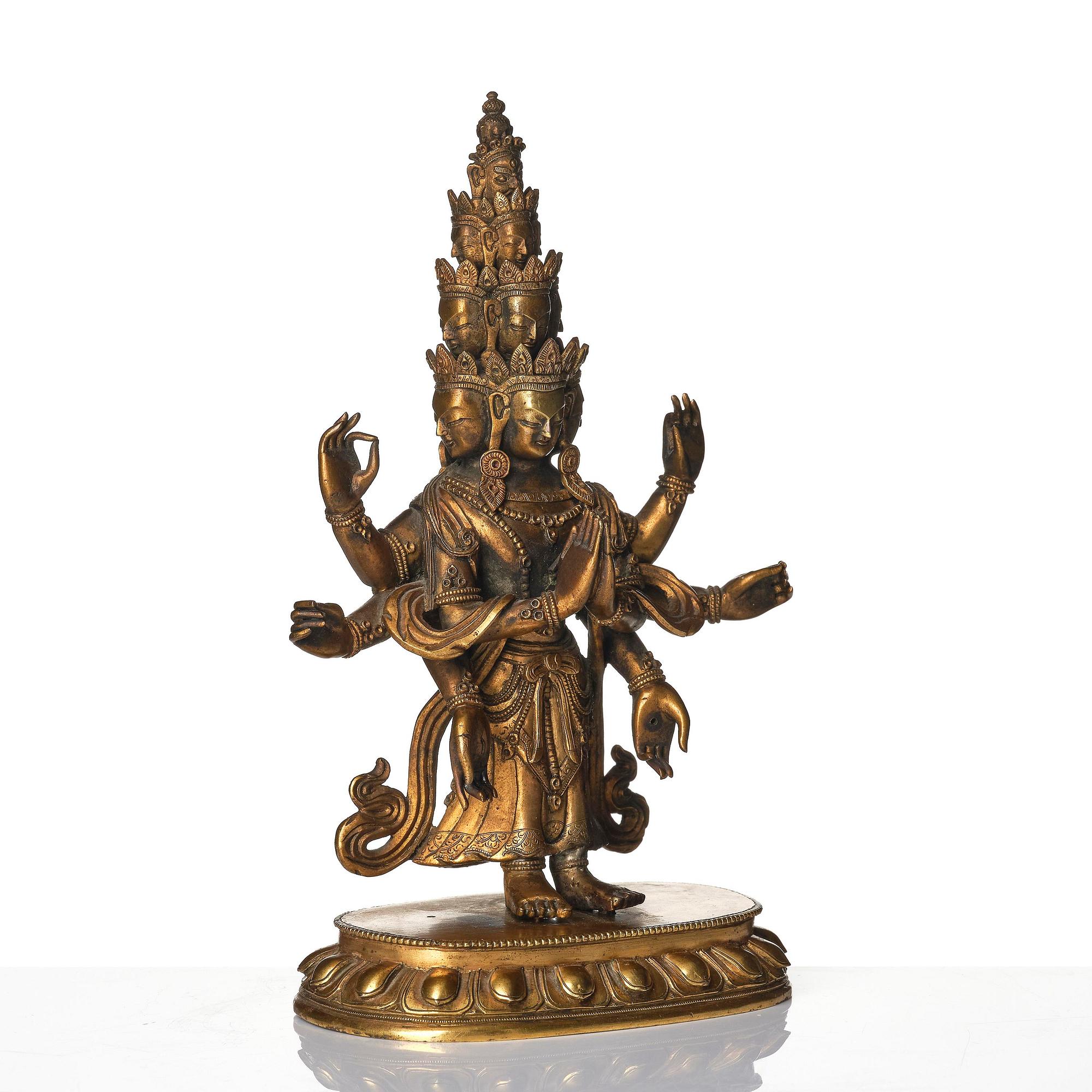 A Tibeto-Chinese gilt bronze figure of Avalokiteshvara Ekasdashamukra, 19th century.