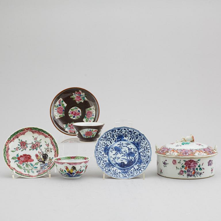 A famille rose butter tureen with cover and two cups with three odd stands, Qing dynasty, Qianlong (1736-95).
