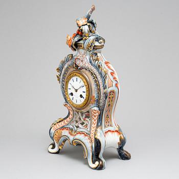 A new rococo creamware bracket clock, after Meissen model, early 20th century.