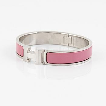 Hermès, a 'Clic H' bracelet.