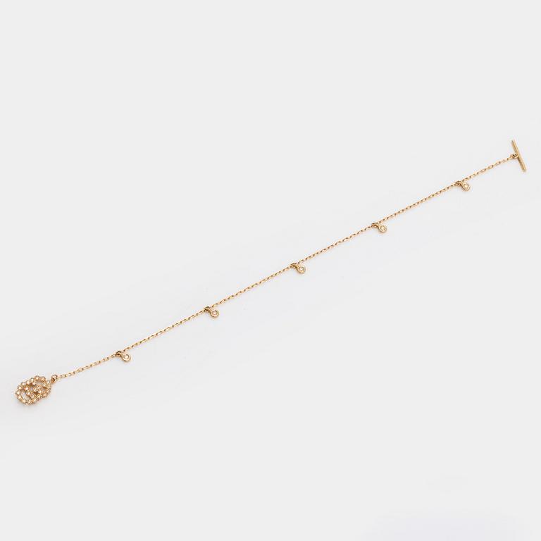 Gucci, armband, "Interlocking", 18K guld med briljantslipade diamanter.