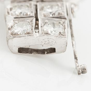 Armband platina med runda briljant, åttkant- och baguetteslipade diamanter, Gübelin.
