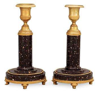 772. A pair of late Gustavian circa 1800 porphyry and gilt bronze candlesticks.