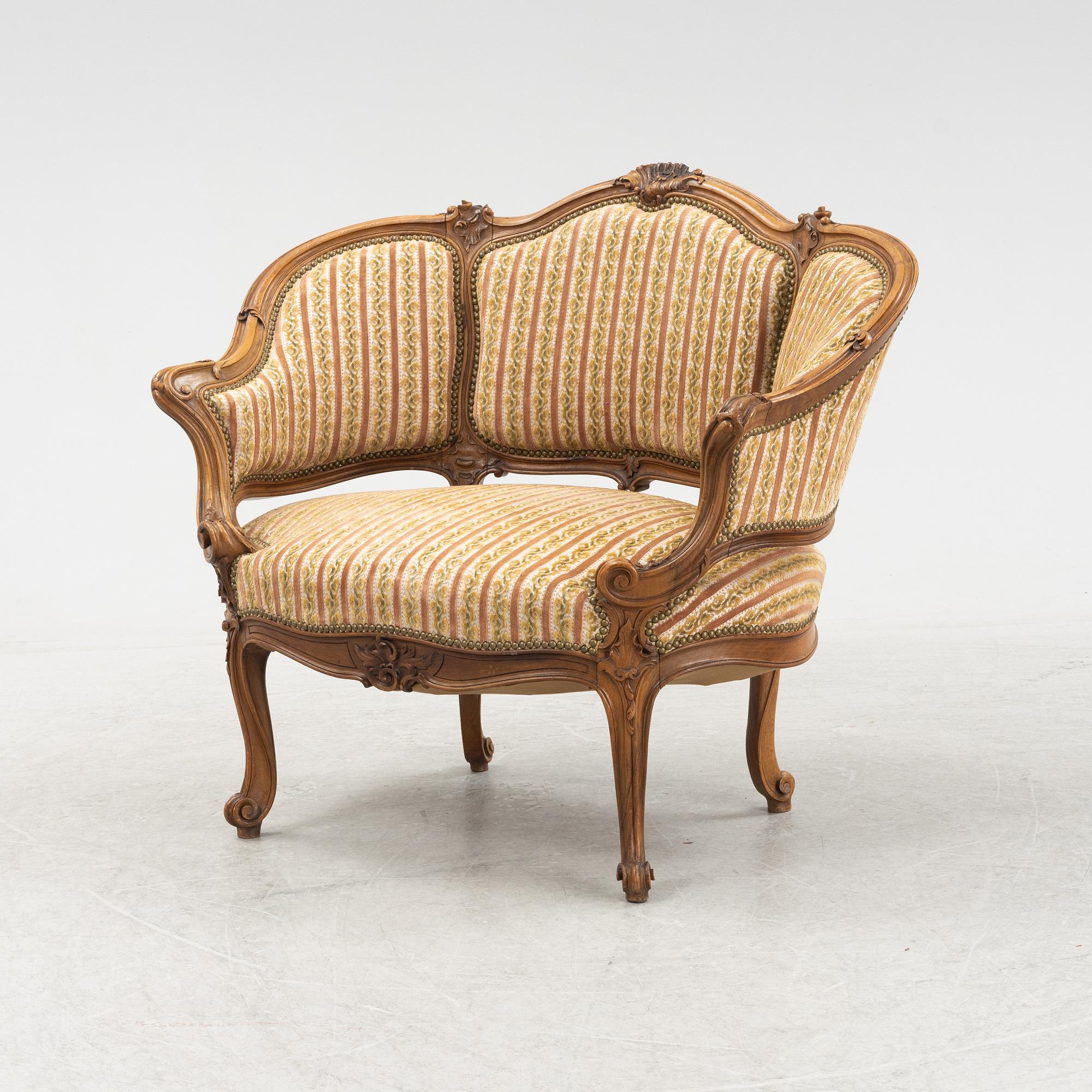 A Louis XV style marquise chair, around the year 1900.