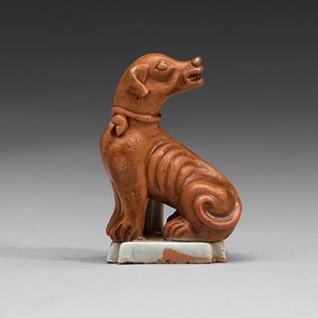 89. A small joss stick holder in the shape of a dog, Qing dynasty, Qianlong (1736-95).