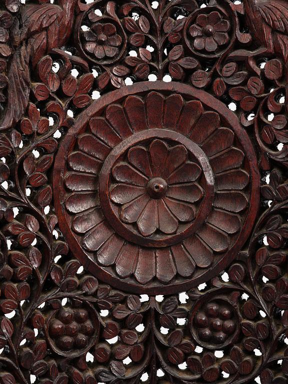 A pair of carved 'blackwood' armchairs, Bombay presidency, British Raj, circa 1880.