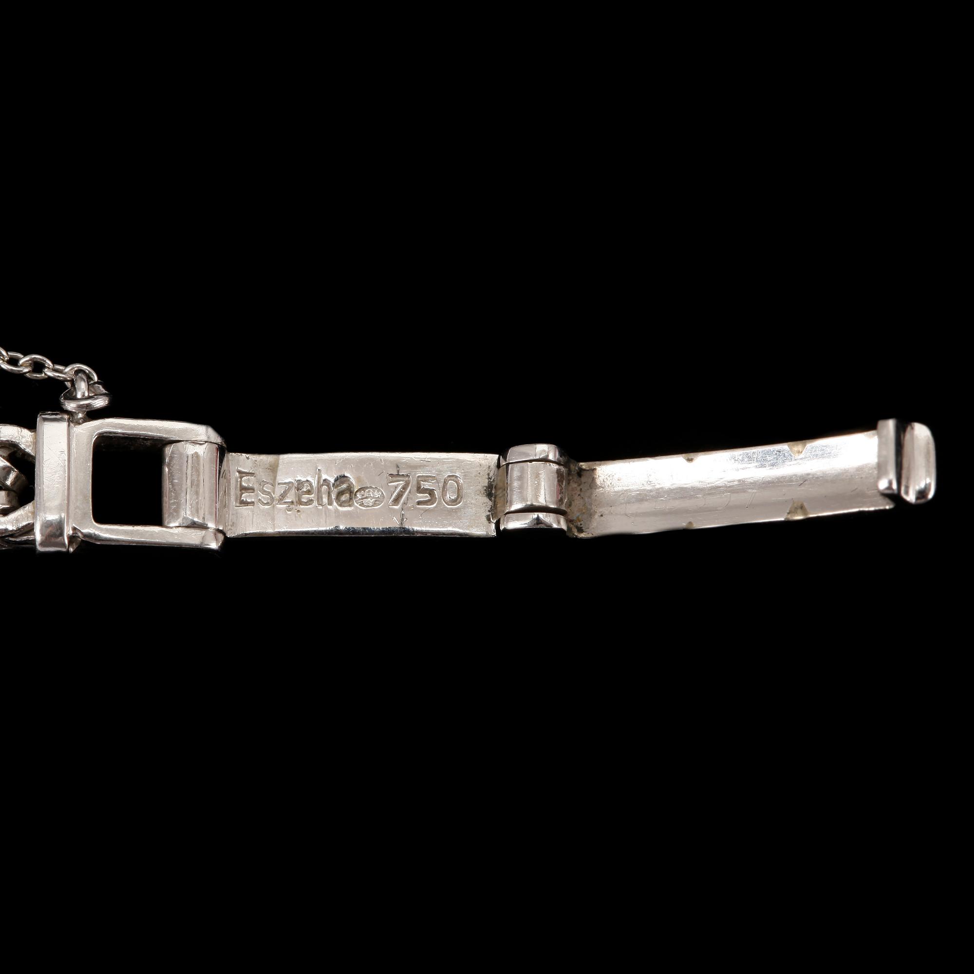 DAMARMBANDSUR, vitguld 18K, med 22 diamanter. Baume & Mercier, Geneve. Svensk importstämpel. Tot ca 21 gram.