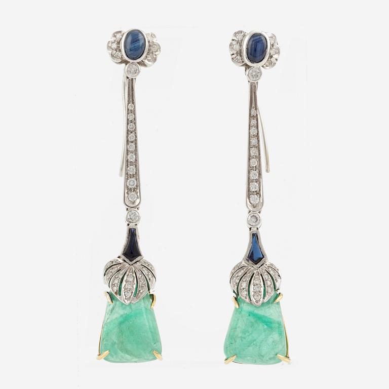 A pair of 18K gold earrings with emeralds, sapphires, and round brilliant-cut diamonds.