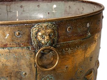 A baroque style brass basin.