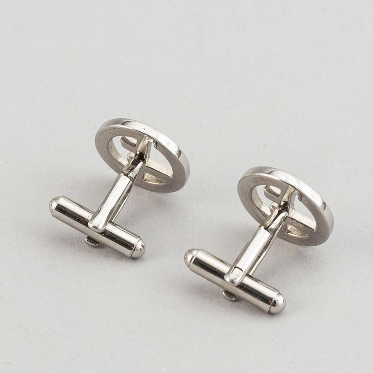 Louis Vuitton and Giorgio Armani, two pairs of cufflinks.