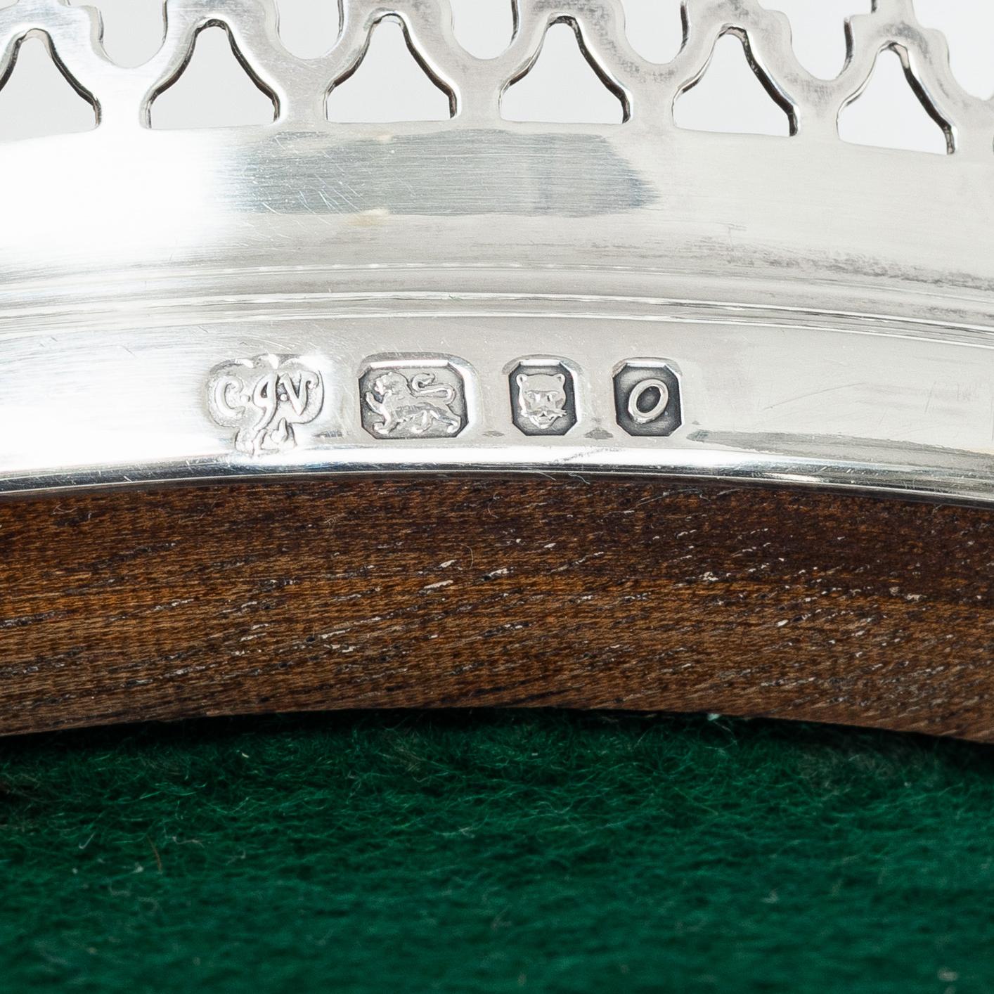 Two English silver coasters, mark of E Edmonds, Birmingham, 1930 and C J Vander Ltd, London 1969.