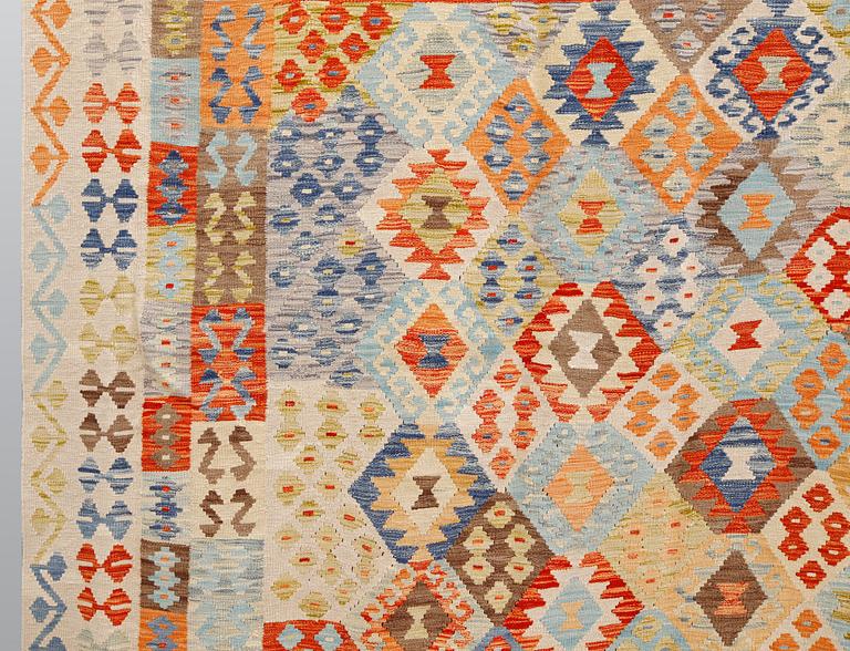 A kilim carpet, ca 350 x 258 cm.