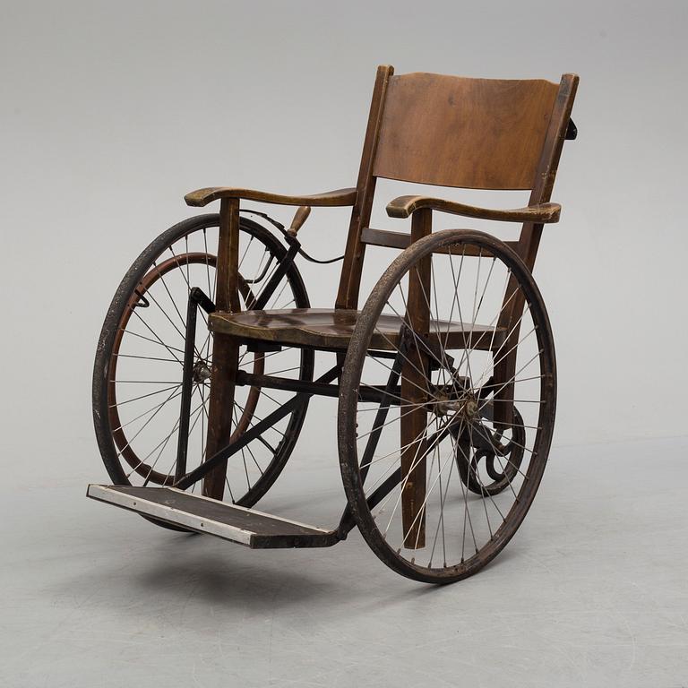 An early 20th century wheel chair.