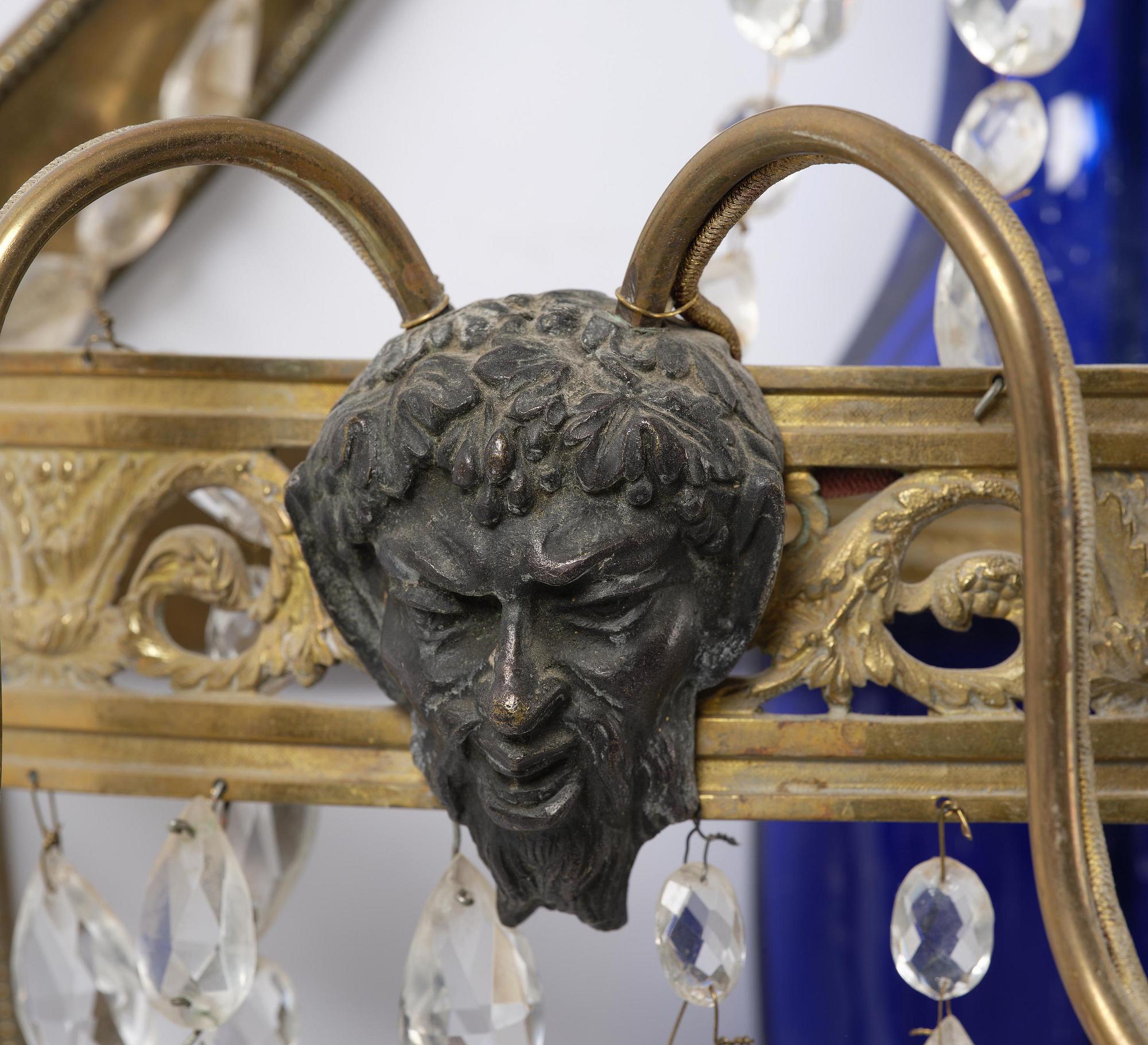 A pair of Russian Louis XVI-style  four-branch gilt bronze appliques, 19th century.