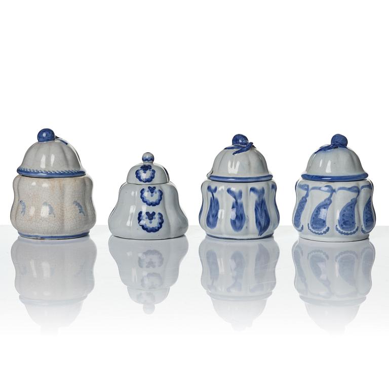 Wilhelm Kåge, eleven pieces of faience including jars, inkwells and a tulip vase, Gustavsberg, Sweden, 1919-1920.