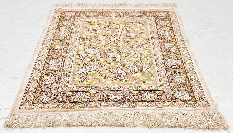 A silk an metal Hereke rug, West Anatolia, c. 100 x 68 cm.