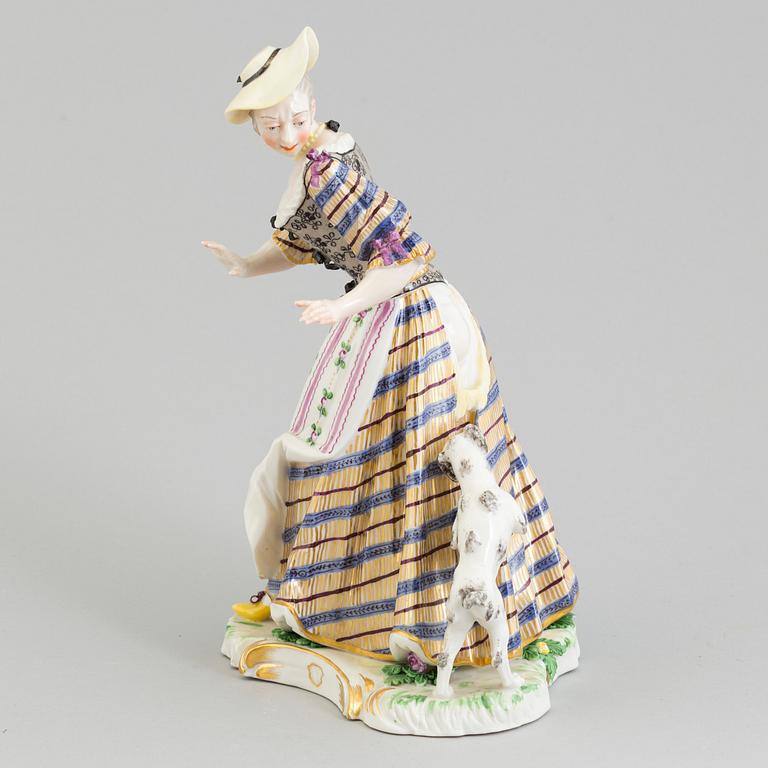 A Nymphenburg porcelain figure of a lady with a dog, Germany, 20th Century.