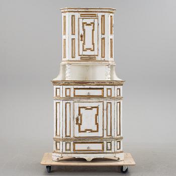 A Baroque style corner cabinet, 19th Century.