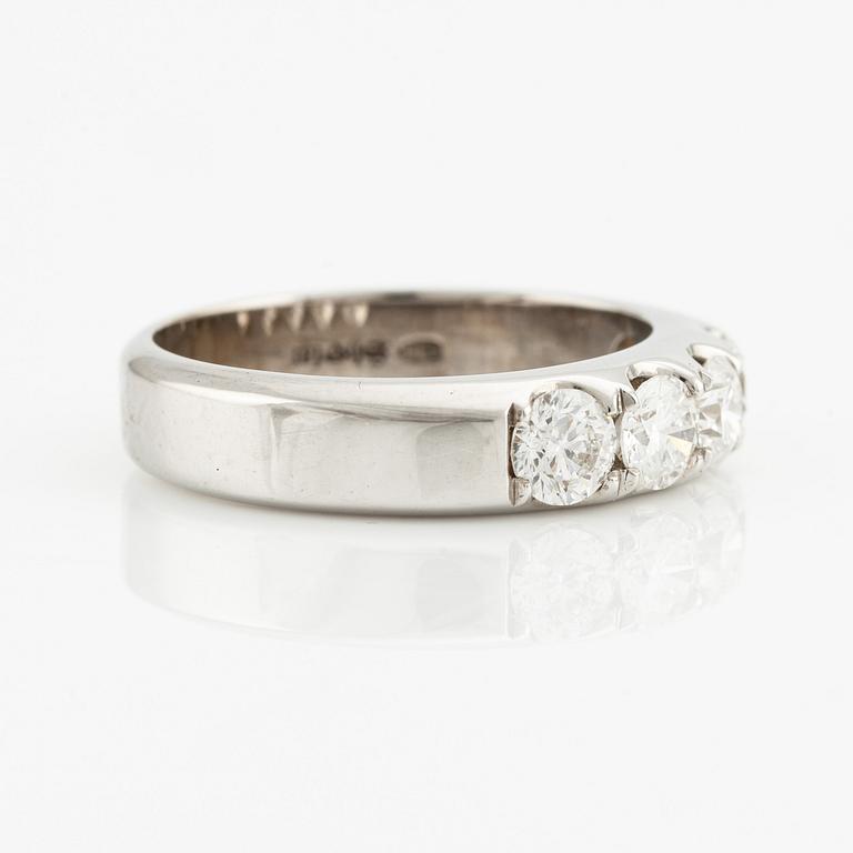 Ring with five brilliant-cut diamonds.