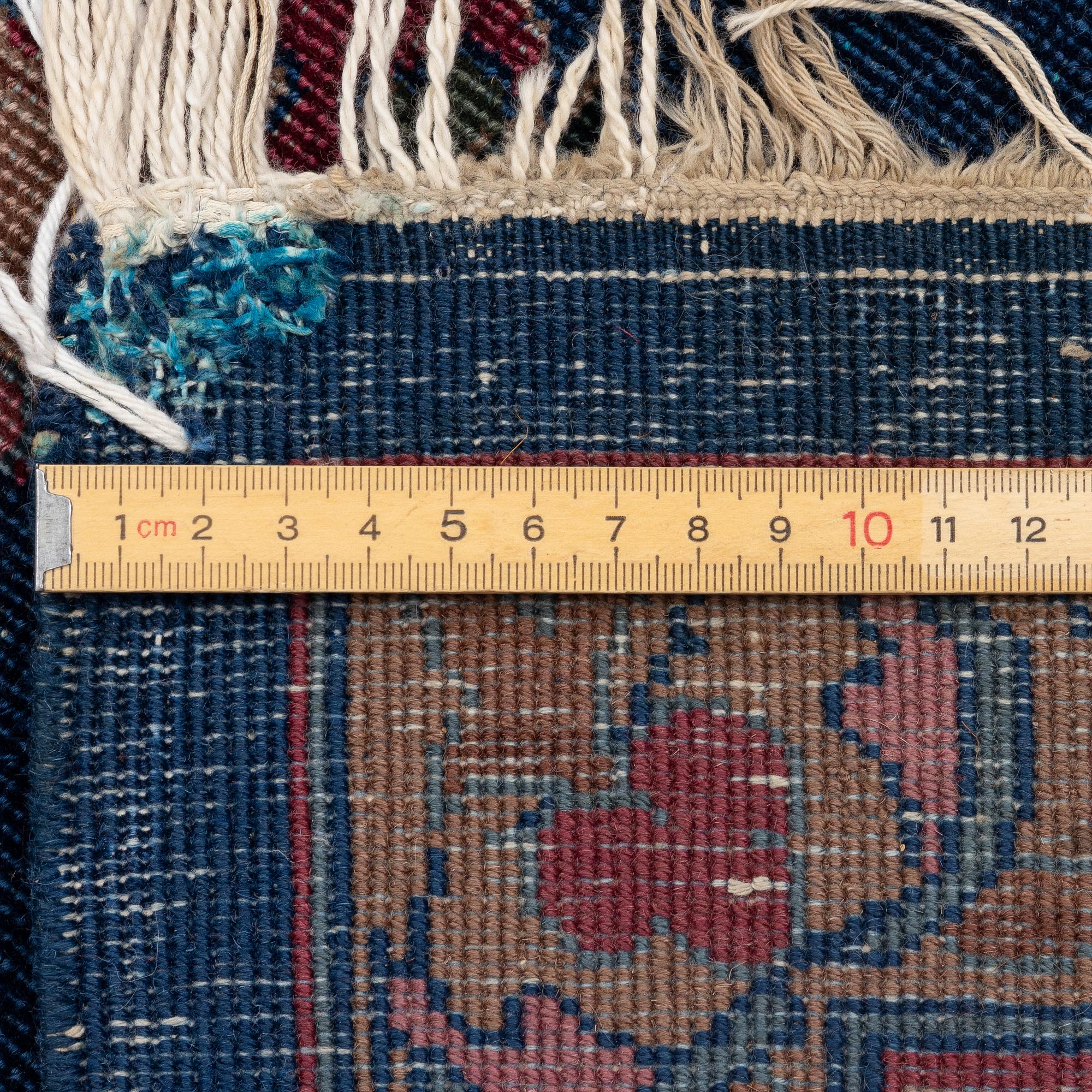 A semi-antique Amritsar carpet, north India c. 359 x 272 cm.