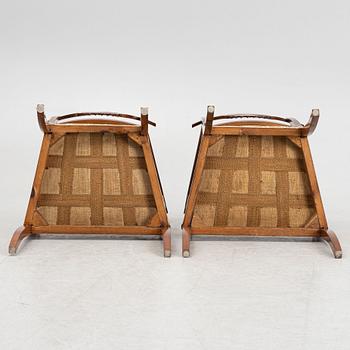 A pair of Swedish Empire mahogany open armchairs, early 19th century.