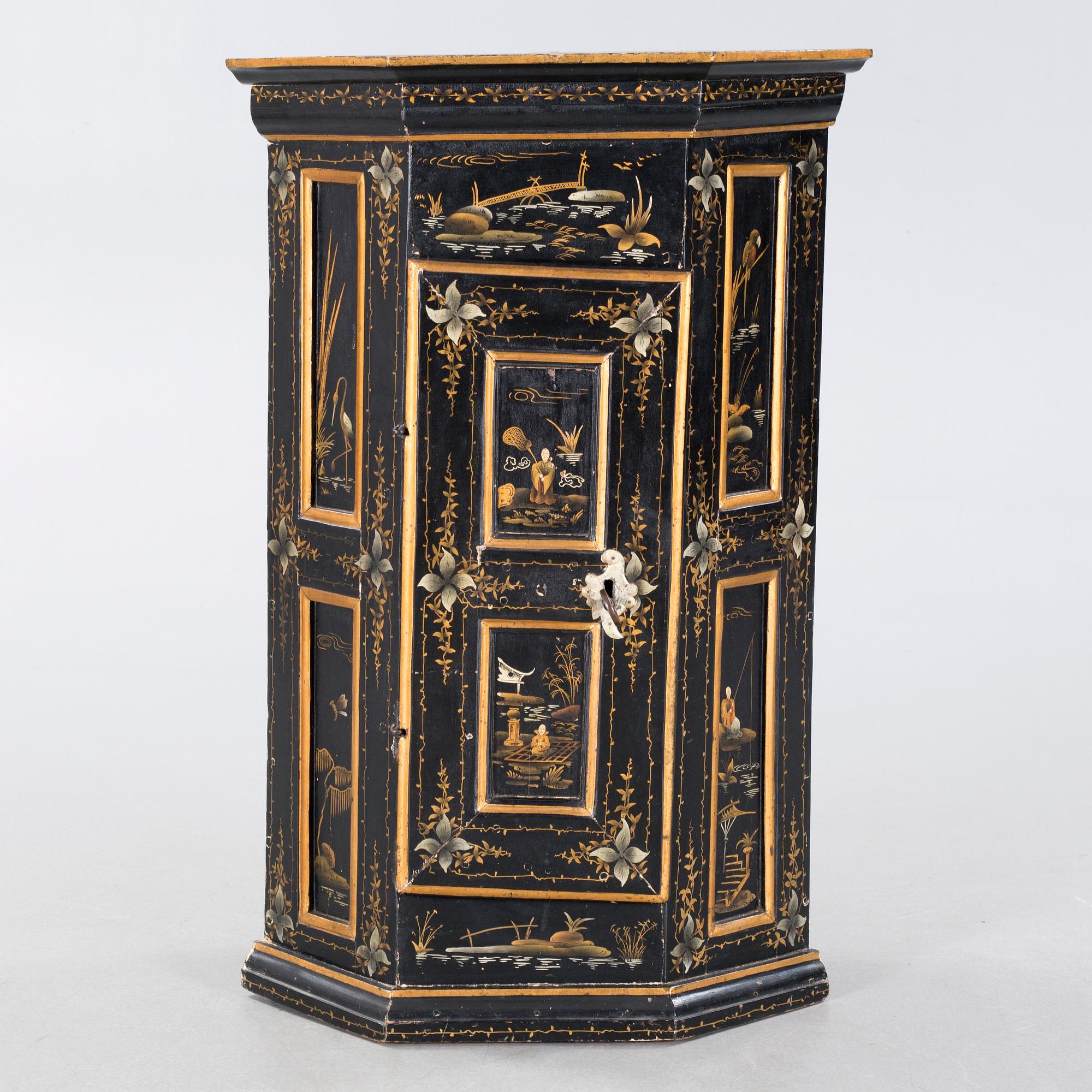An 18th century corner cabinet.