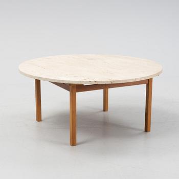 An oak coffee table with a later travertine top.