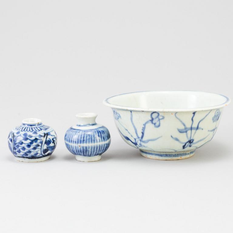 A blue and white Chinese porcelain bowl and two miniature jars for the South East Asian market, probably Ming dynasty.