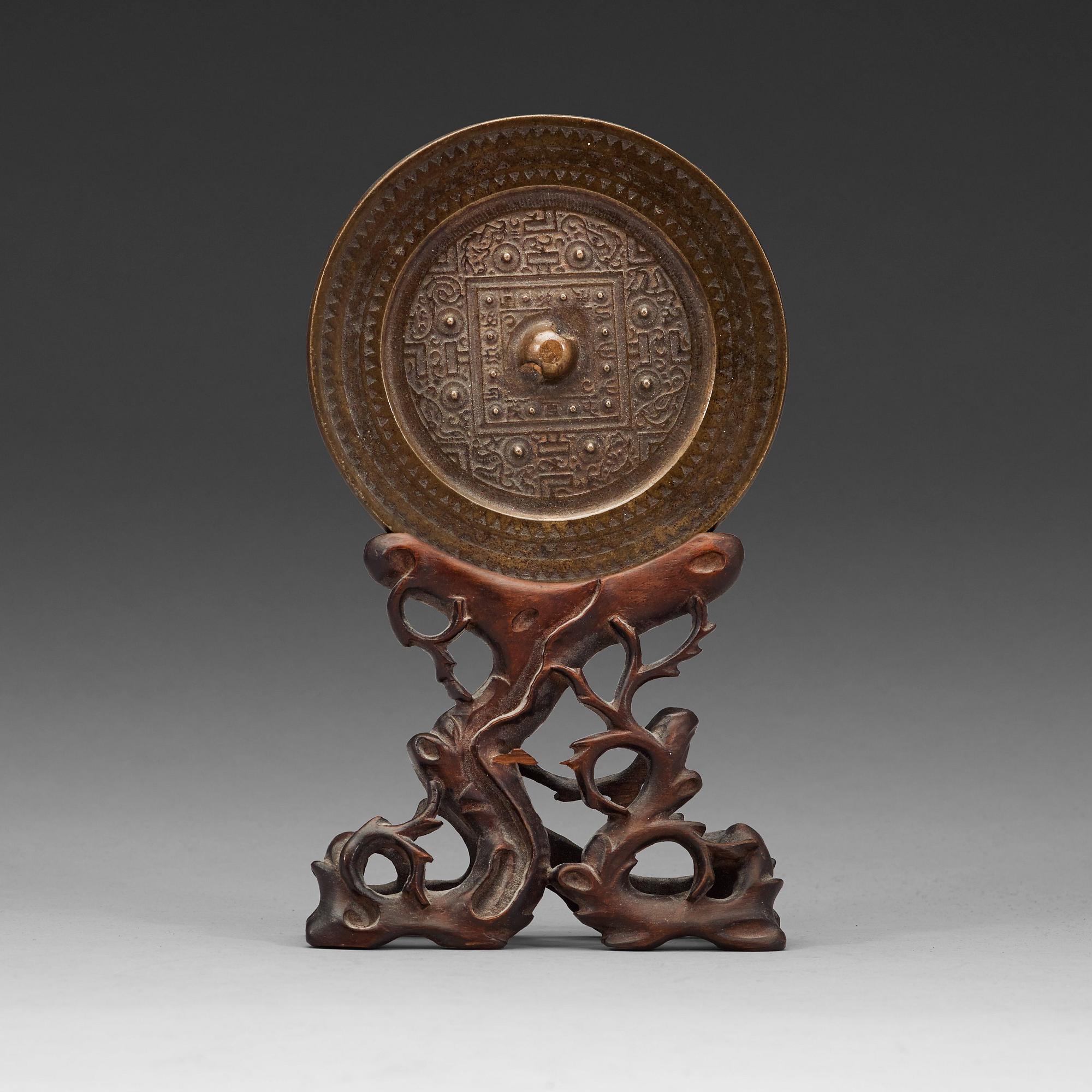Ana archaistic bronze mirror.