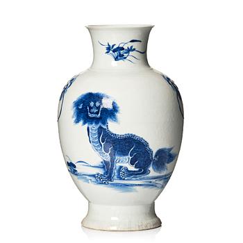 A blue and white bronze shaped vase with mythical creatures, Qing dynasty, 19th Century.