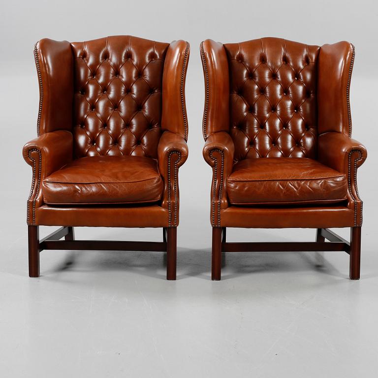 ÖRONLAPPSFÅTÖLJER, ett par, "Churchill Wing Chair", Claridge Upholstery, England, 2005.