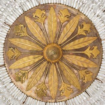 An ormolu and cut glass sixteen-branch Empire chandelier, Paris, early 19th century.