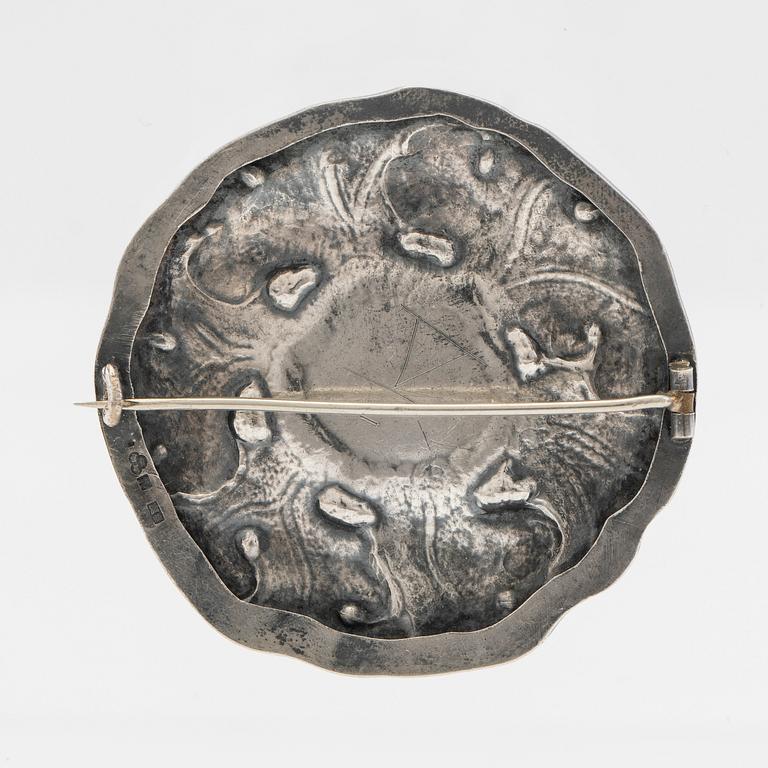 Brosch, silver med grön sten.