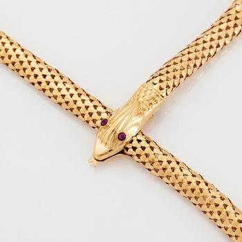 An 18K gold snake necklace.