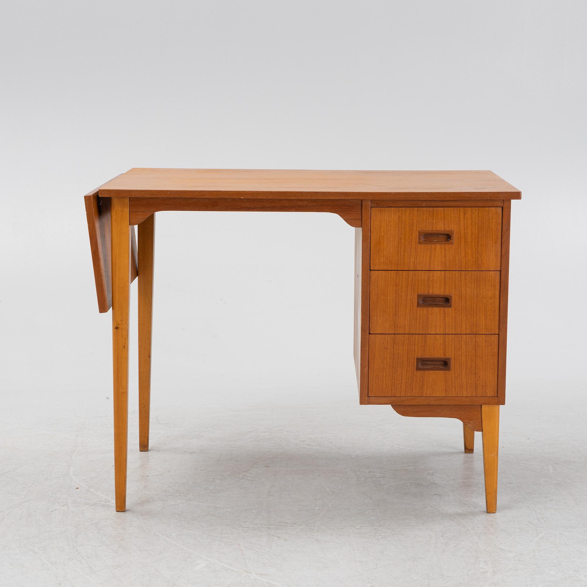 A teak veneered desk, mid 20th Century.