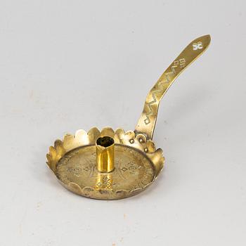 An English 18th century brass night light holder.