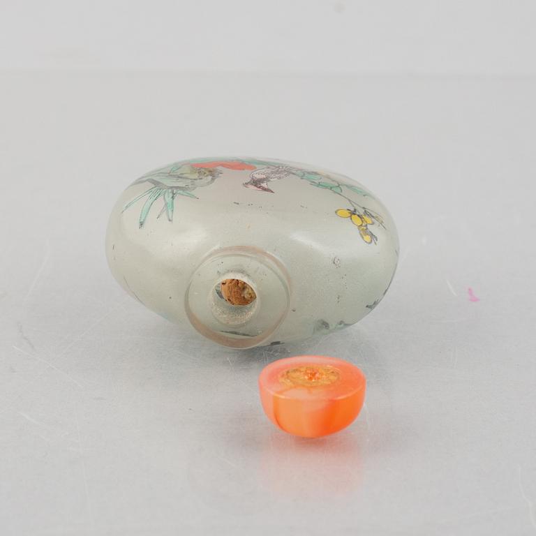 A group of nine Chinese glass and porcelain snuffbottles, 20th century.