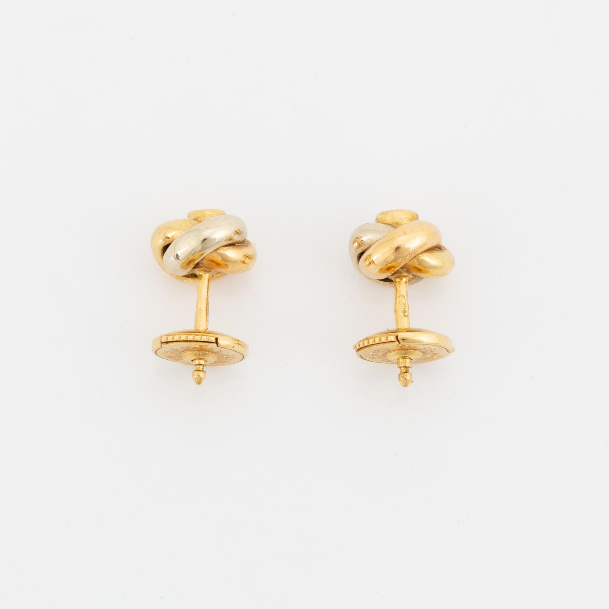 Ett par örhängen Cartier "Trinity" 18K guld med runda briljantslipade diamanter.
