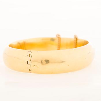 A 19th Century Russian 14K gold (56) bangle, maker's mark GS, Saint Petersburg.