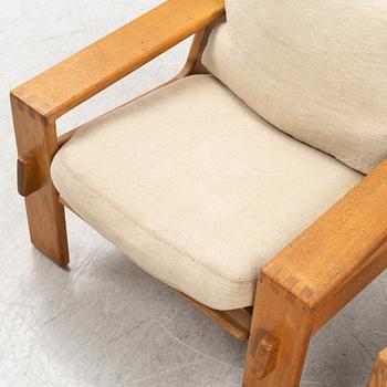 Esko Pajamies, a pair of oak 'Bonanza' lounge chairs from Asko, 1970's.