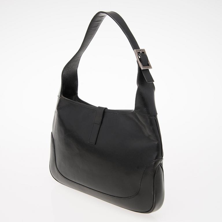 A Black Leather Jackie Bag.