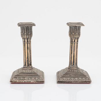 A pair of silver candlesticks, William Hutton & Sons Ltd, London, England, 1902.